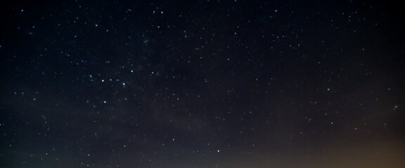 Fototapeta na wymiar star in space with blur dark sky background at night