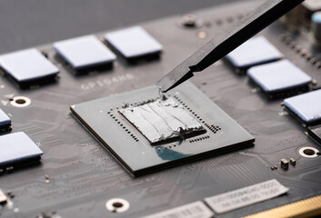 Applying thermal paste to a computer processor. Processor installation concept and cooling...