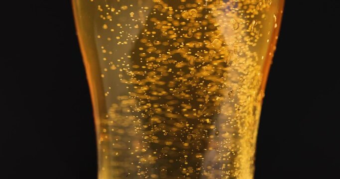 Closeup of glass with cold beer and bubbles 4k movie slow motion. Oktoberfest concept