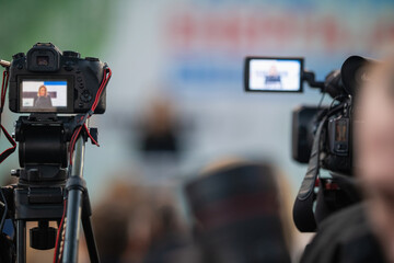 Media camera focuses on capturing the vibrant pulse of a buzzing media event