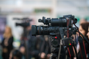 Media camera focuses on capturing the vibrant pulse of a buzzing media event