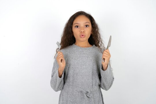hungry Beautiful teenager girl  holding in hand fork knife want tasty yummy pizza pie