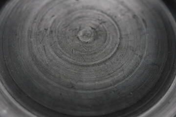 Rough graphite texture of black ceramics. Selective focus. Copy space.