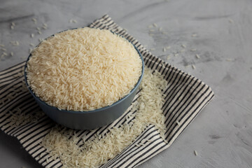 Dry Jasmine Rice in a Bowl, side view. Copy space.