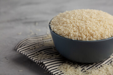 Dry Jasmine Rice in a Bowl, side view. Space for text.