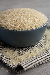 Dry Jasmine Rice in a Bowl, side view. Close-up.