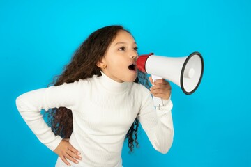 Funny Young beautiful teen girl People sincere emotions lifestyle concept. Mock up copy space. Screaming in megaphone.