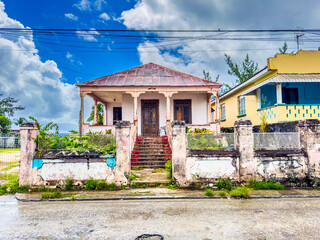 Bridgetown, Barbados -  frontal view of an old colorful abandoned city villa at Bay Street in...