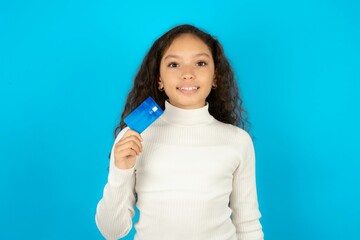 Photo of happy cheerful smiling positive Young beautiful teen girl recommend credit card