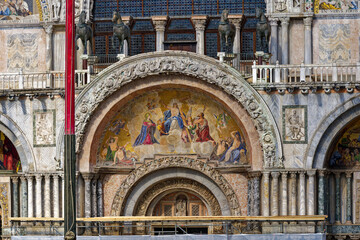 Old town of Italian City of Venice with facade of cathedral with painting at Piazza San Marco...