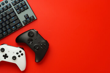 Gamer equipment on red background top view