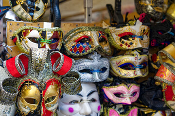 Close up of colorful carnival masks at market stall at City of Venice on a cloudy summer day. Photo taken August 6th, 2023, Venice, Italy. - Powered by Adobe