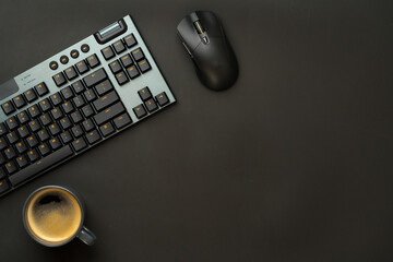 Computer keyboard and mouse on black background