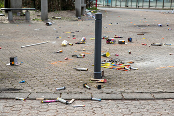 Fireworks rocket launcher box trash remains on german city street after Silvester party traditional...