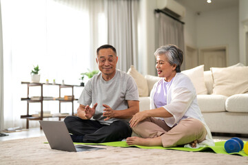 Portrait sport senior asian couple training and sitting relax practicing yoga, elderly health, fitness, exercise, wellness, workout, sport at home.retirement concept.Fitness, senior healthy lifestyle
