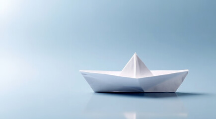 Obraz premium Creative image of white origami ships placed behind blue and orange paper ship representing concept of leadership on light background Copy space. Business concept design.