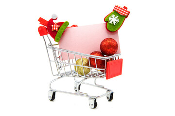 Blank greeting card with wooden decorative clothespins and Christmas tree toys in supermarket...