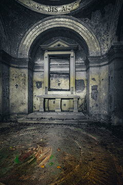 The abandoned mausoleum with open coffins