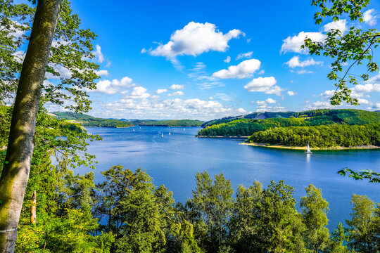 View of the Biggesee near Attendorn in the Olpe district with the surrounding nature. Landscape by the lake in the Sauerland. Bigge Dam.
