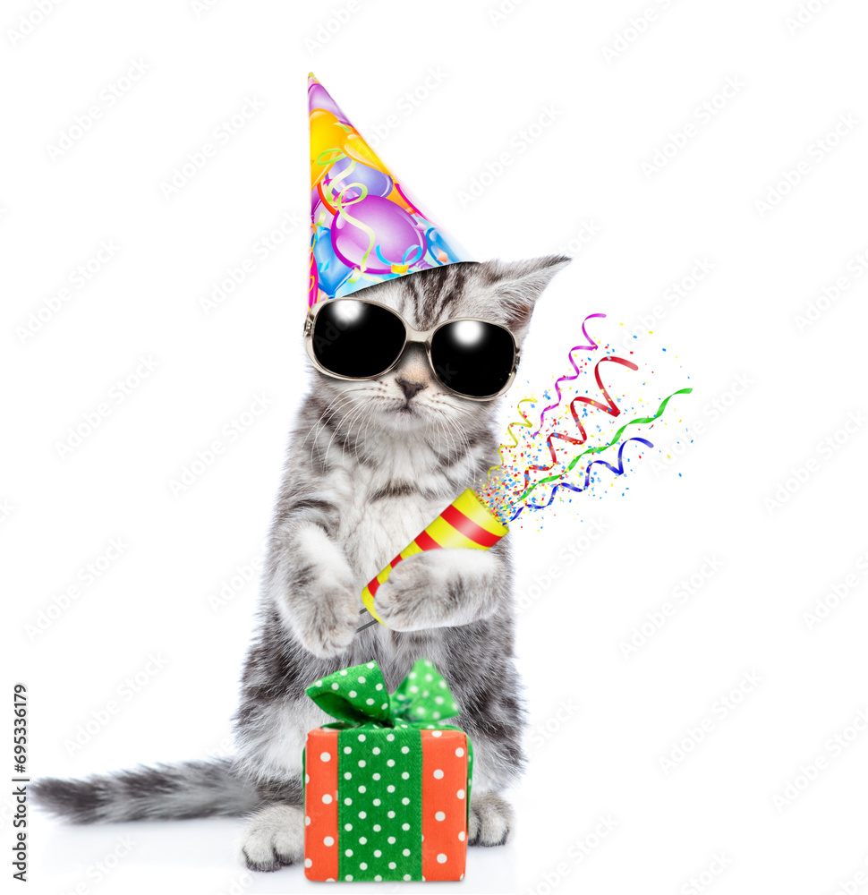 Aufkleber cute cat wearing sunglasses and party cap holds exploding firecracker. isolated on blue background
