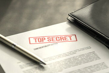 Top secret document on the table. Confidentiality letter on the desk. - obrazy, fototapety, plakaty