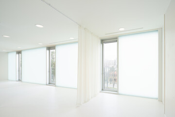 White room with glass windows and curtain in hospital