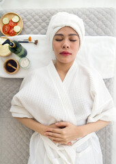 Beauty Treatment. Close-up portrait of beautiful girl dressed in bathrobe and a towel on her head. Traditional thai oriental aromatherapy beauty treatment