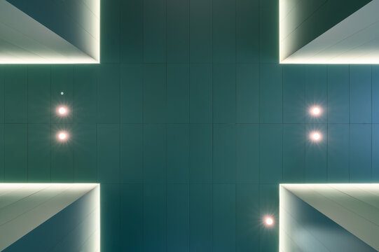 Recessed lights on ceiling with columns on corners in hospital