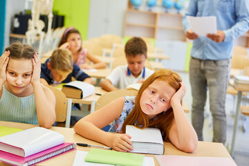 Upset female students in classroom