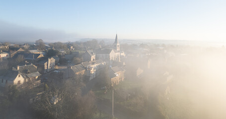Obraz premium Centres french town in fog drone view