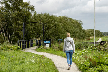 Hiking along lake Schildmeer between Schildwolde en Overschild in municipallity MIidden-Groningen Groningen province in The Netherlands