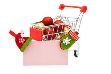 Blank greeting card with wooden decorative clothespins and Christmas tree toys in supermarket...