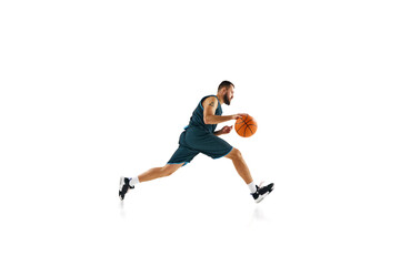 Fototapeta na wymiar Dynamic, energetic portrait of sportsman, basketball player training slam dunk technique against white background.