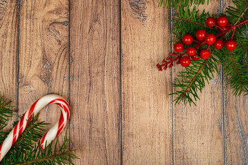wood background with Christmas tree and candy. toning. selective focus