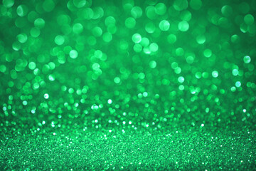 St. Patricks Day abstract green bokeh lights background. Unfocused abstract red glitter holiday...