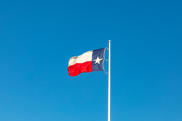 state flag of texas fluttering in the wind