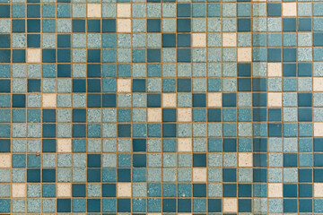 pattern of small tiles at the floor in different blue colors as harmonic background