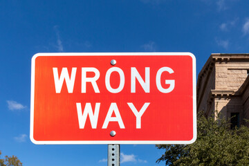warning sign wrong way on red background