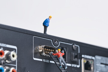 Repairing an old socket serial port, dusty old interface, miniature figures scene