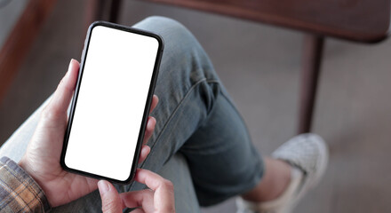 cell phone blank white screen mockup.hand holding texting using mobile on desk at office.background empty space for advertise.work people contact marketing business,technology