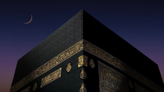 Mecca Saudi Arabia: Crescent moon rises on the Kaaba. Holy mosque of Makkah With moon rising in the sky. Haram Mosque minaret in a cloudy evening. Close up shot written in Arabic: "Allah is Great" 