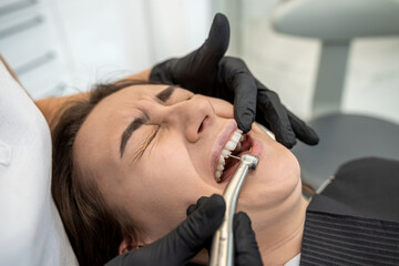 beautiful young woman is doing a dental examination in the dental office.