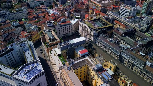 Aerial view of the Borsa Piazza Affari. Krishi houses in the city. Attractions for tourists. A crisis. Statue of the middle finger on the hand. Finance. Architecture. Italy, Milan, 12.12.2023