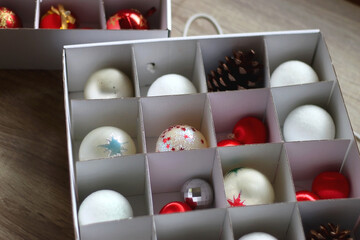 Boxes with various organized Christmas ornaments. Decorating or taking down the Christmas tree....
