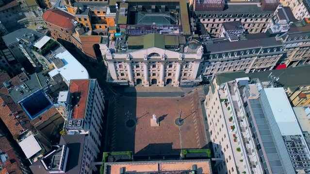 Aerial view of the Borsa Piazza Affari. Krishi houses in the city. Attractions for tourists. A crisis. Statue of the middle finger on the hand. Finance. Architecture. Italy, Milan, 12.12.2023