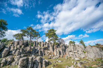 Fototapeta premium The fantastic view of Adam Kayalar, which means the Man Rocks, resembles several standing men, people have already named them Avatar Land due to their peculiar and fantastic structure.