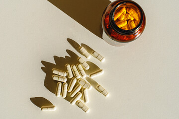 Jar with pills on a white background. View from above. Morning routine.