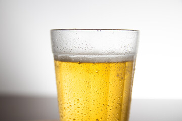 Close up Glass of light beer on typical brazilian cup (americano long drink).