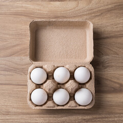 Organic white leghorn egg from free range farm in paper tray on wooden table, Top view - obrazy, fototapety, plakaty