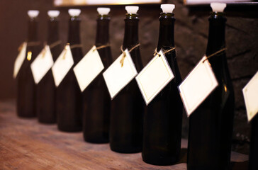 Wine bottles in the row on wooden table